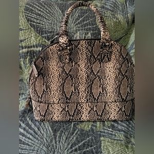 Snake print faux leather round top purse
